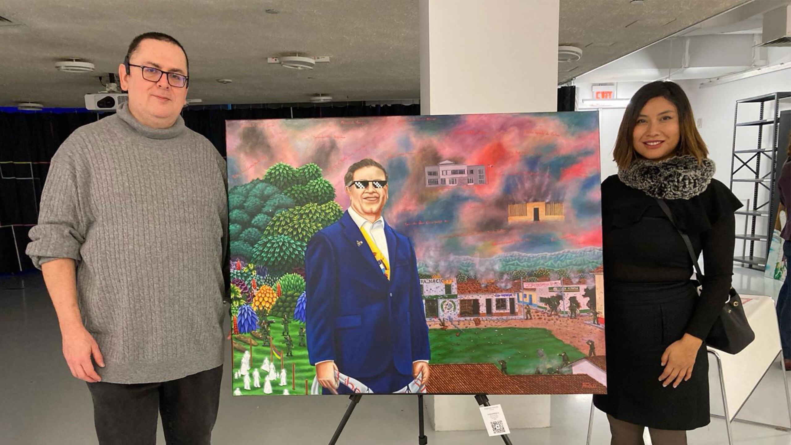 Two people standing beside a painting at an art exhibition.