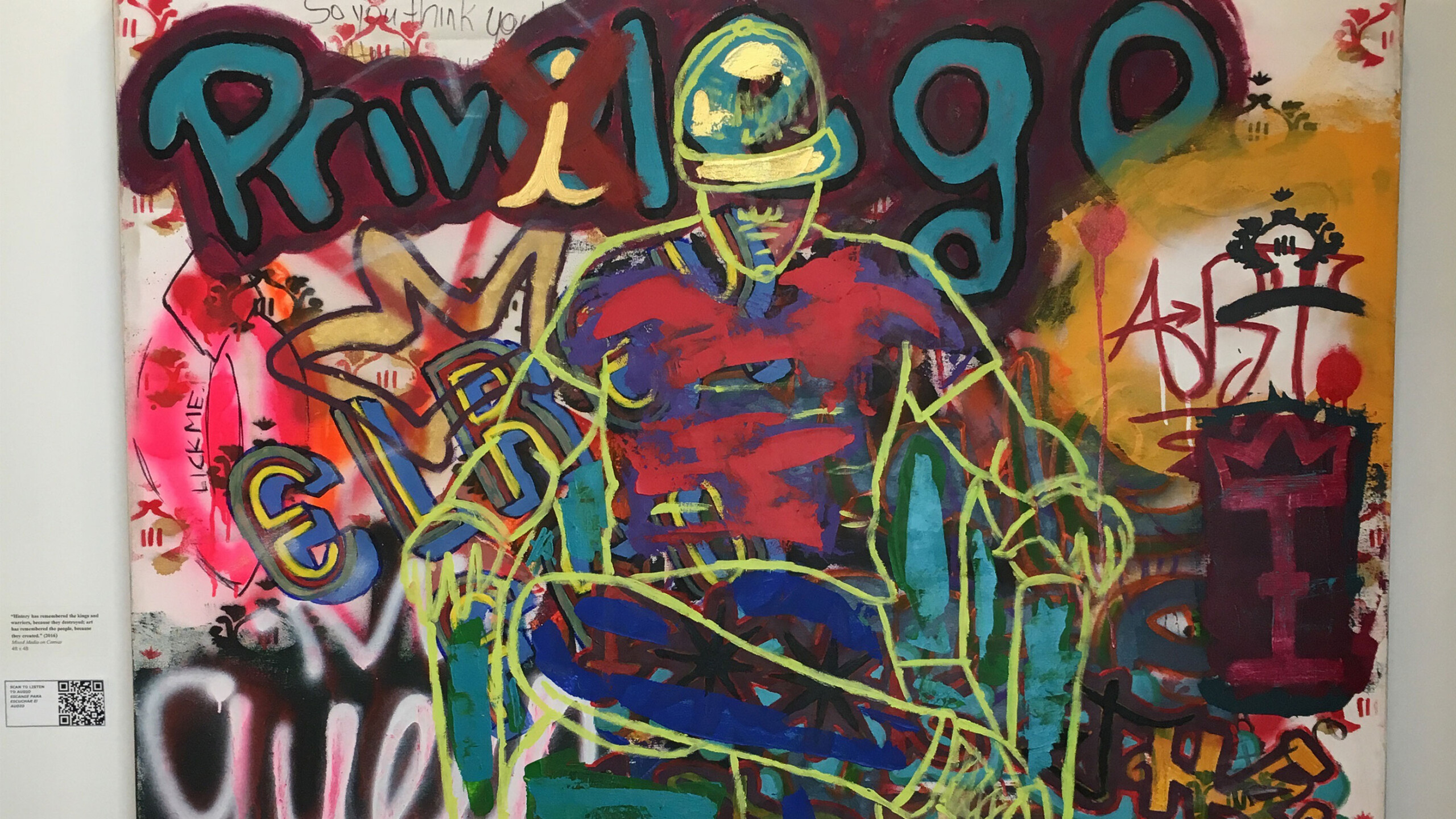 A vibrant and chaotic graffiti-style painting featuring a stylized figure in the center, outlined in green and blue, wearing a red and blue outfit and a yellow...