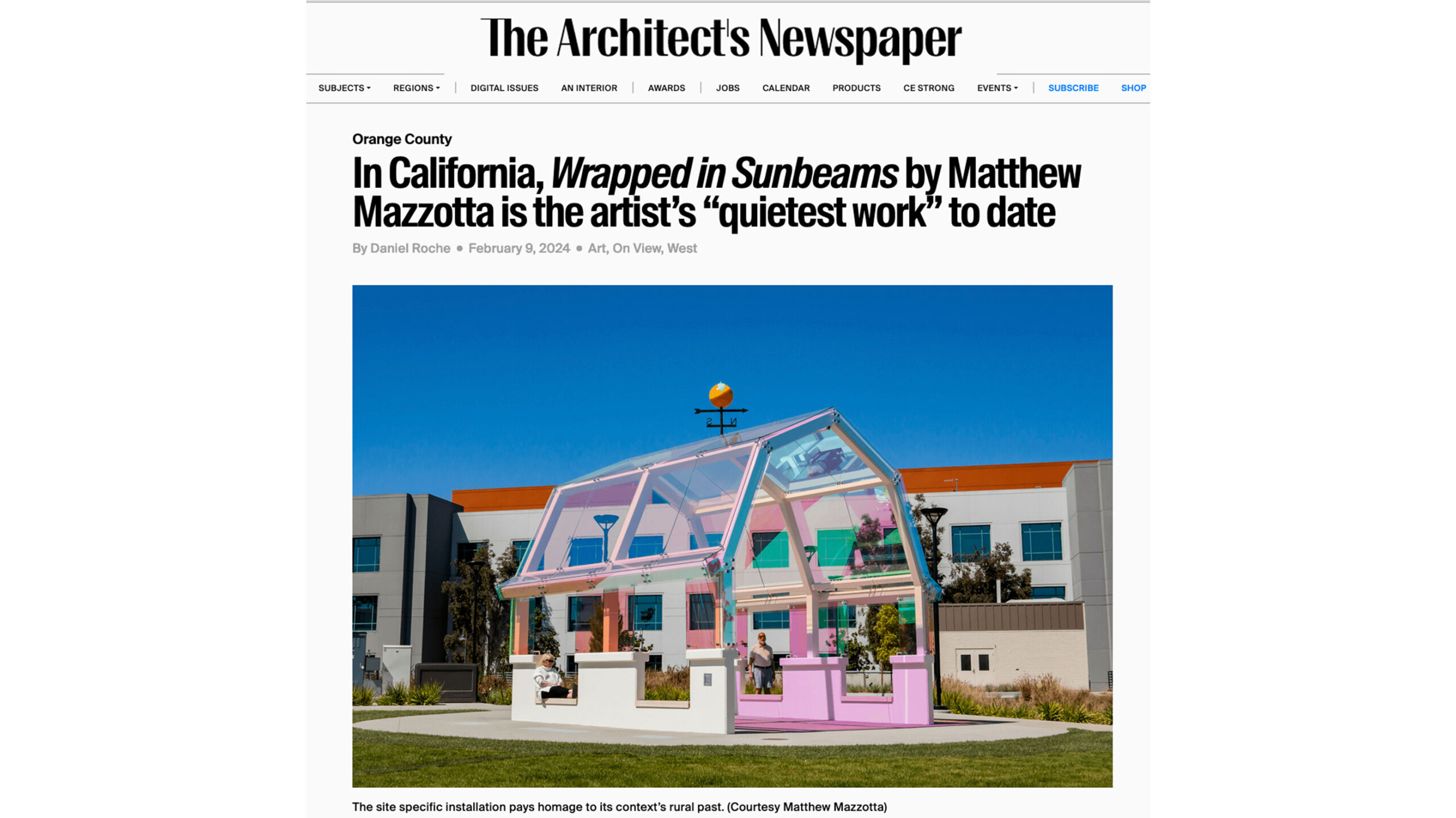 A vibrant pink and transparent greenhouse-like structure stands in front of a modern, urban building. The structure appears to be composed of a translucent roof...