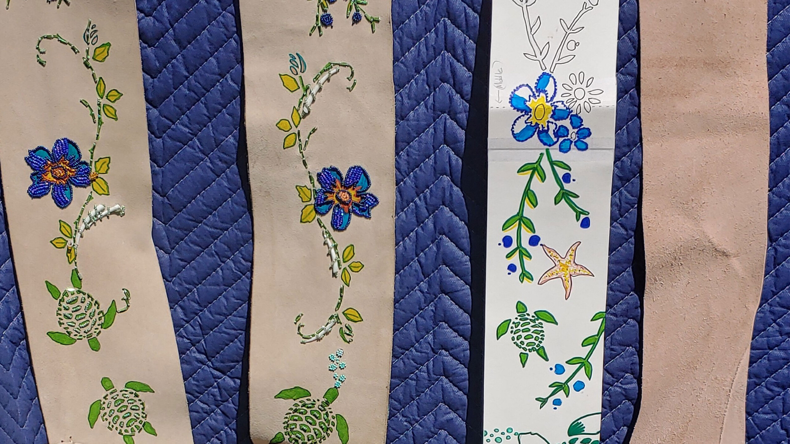 Five vertical fabric strips with varying textures and floral patterns.