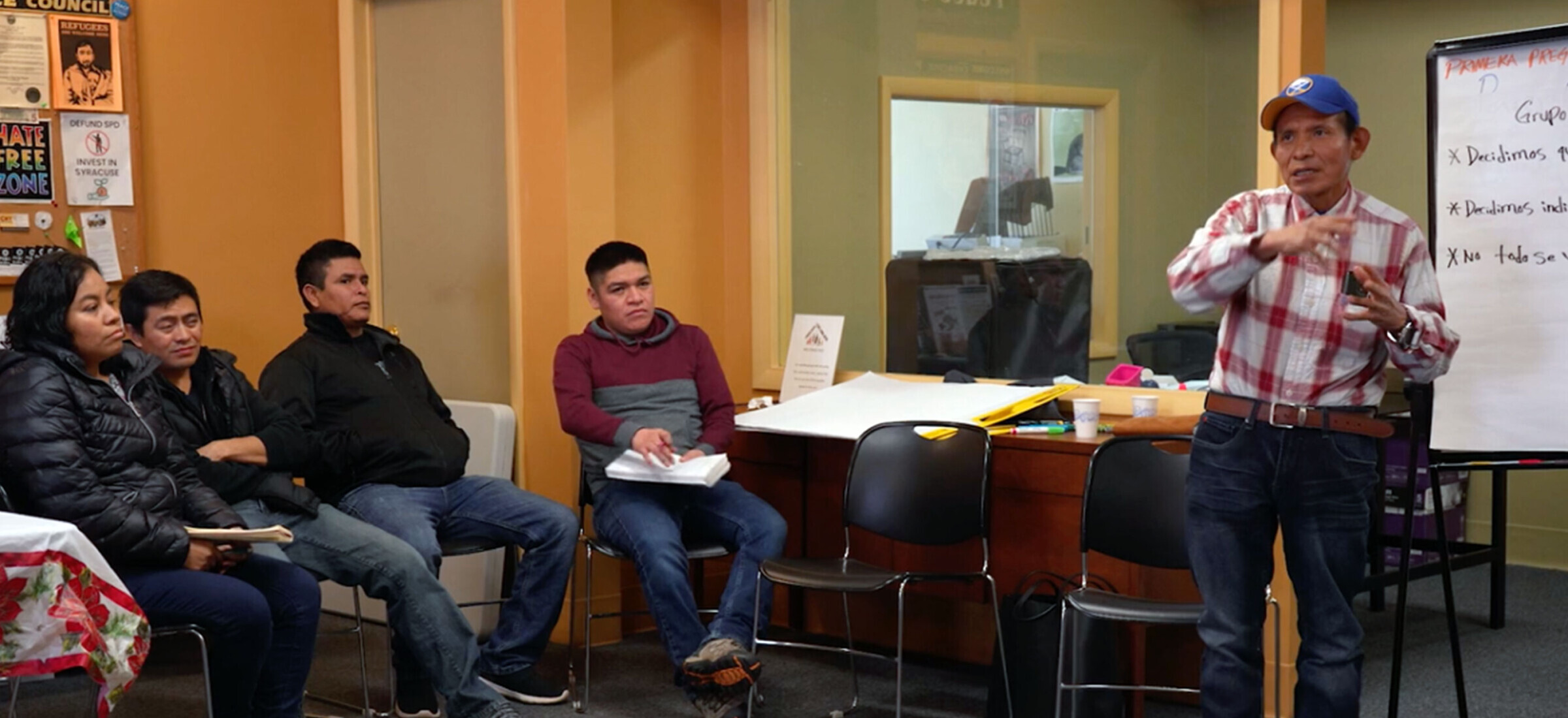 Photo of collaborators at Workers Center of Central New York sharing personal stories.