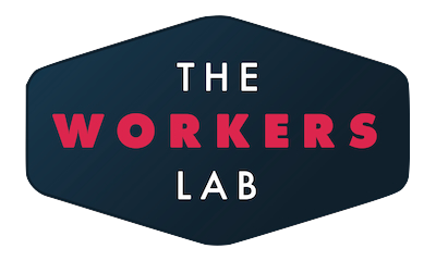 A hexagonal-shaped logo with a dark blue background. The text THE WORKERS LAB is in uppercase, with WORKERS highlighted in bold red.